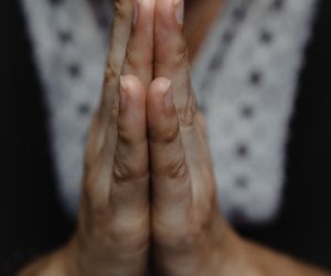 Close-up of hands in a meditative mudra position.