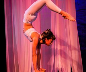 Person performing a deep, controlled stretch.